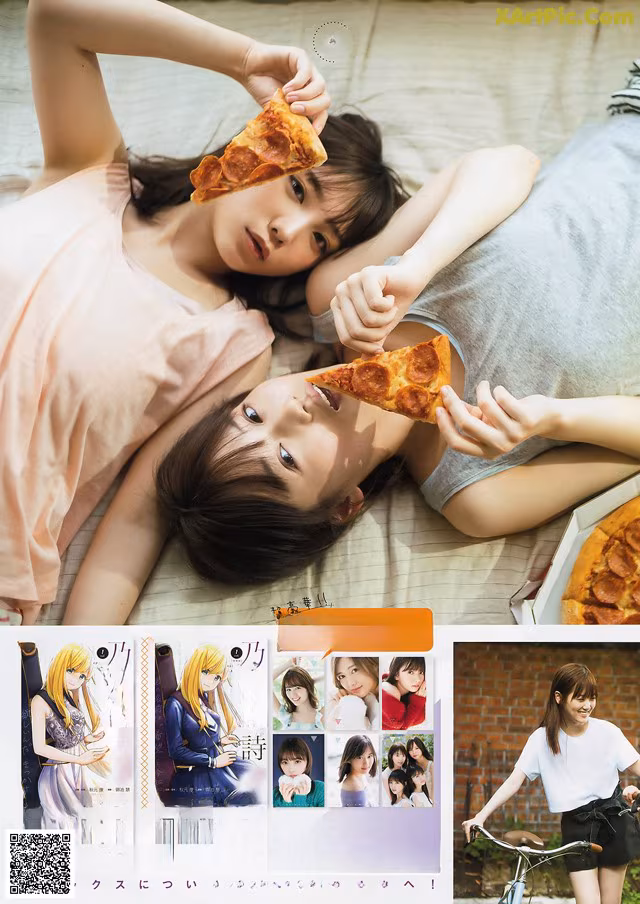 A couple of girls laying on top of a bed eating pizza.