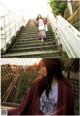 A woman is walking up some stairs in a park.