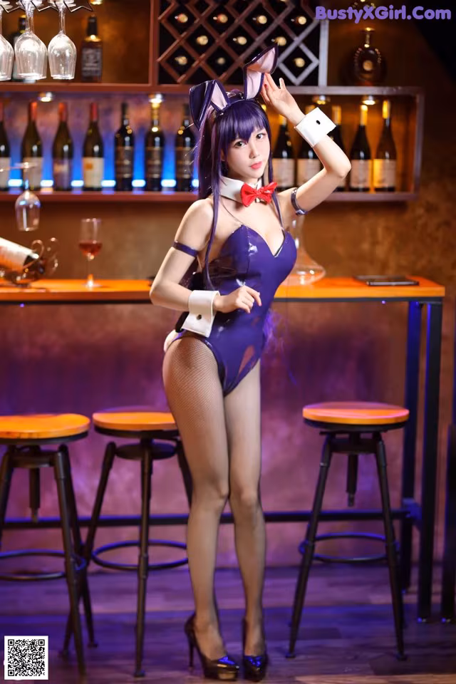 A woman in a bunny costume posing in front of a bar.